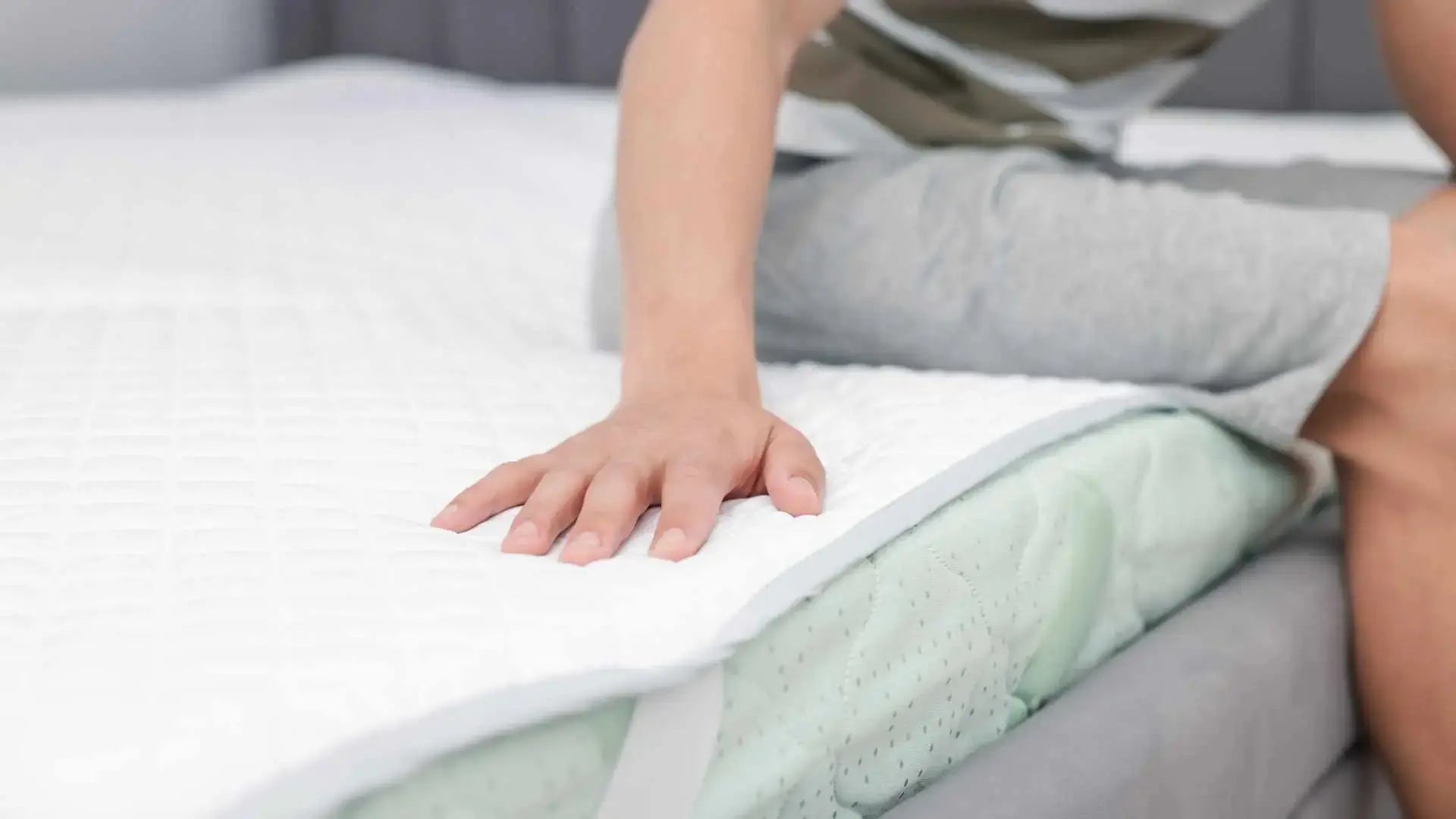 Installing grounding mattress pad on bed for full-body grounding setup
