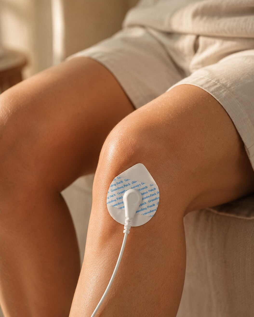 Grounding patch applied to the knee with cord attached