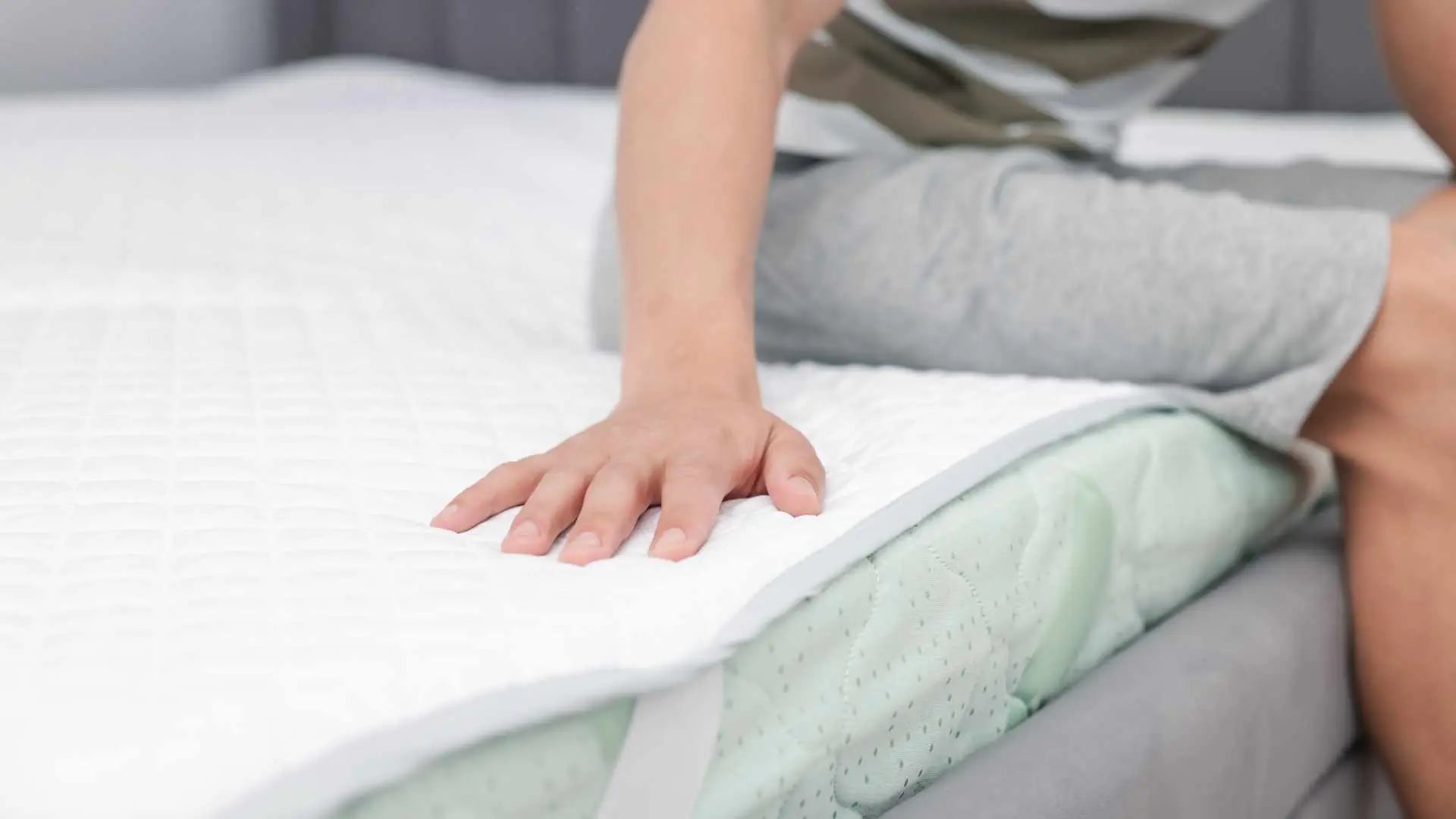 Installing grounding mattress pad on bed for full-body grounding setup