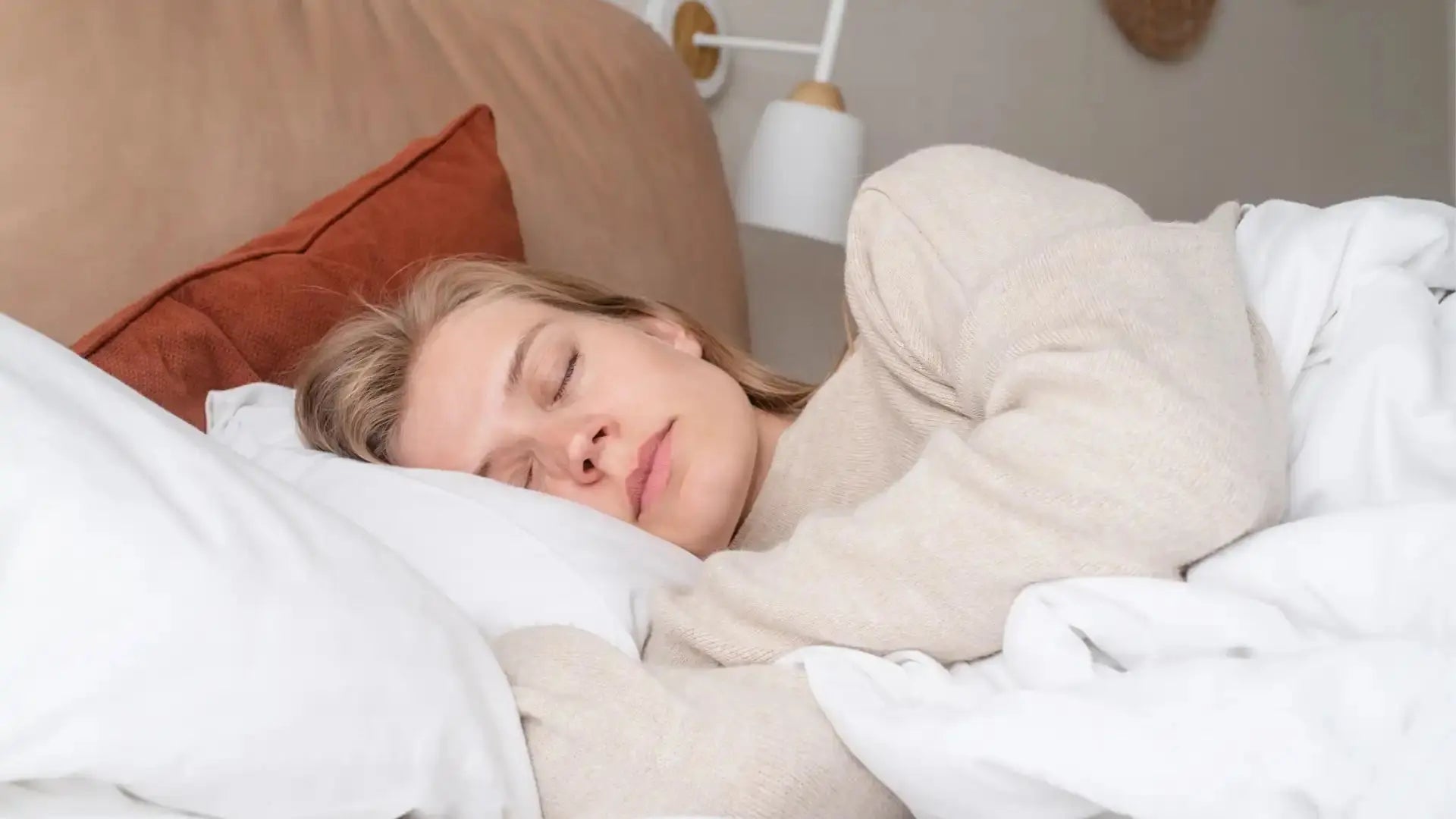 Woman sleeping in a modern bedroom for grounding sleep