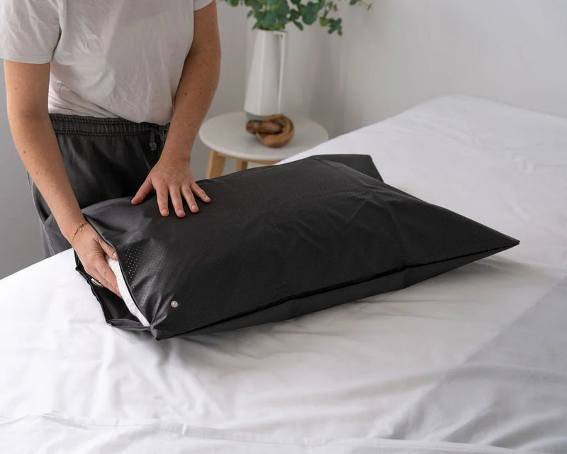 Grounding pillow cover placed on bed